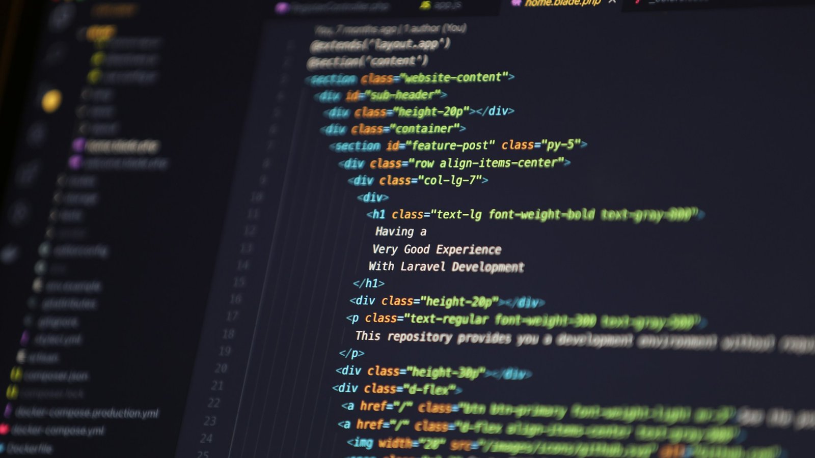 A computer monitor on a desk displaying lines of source code