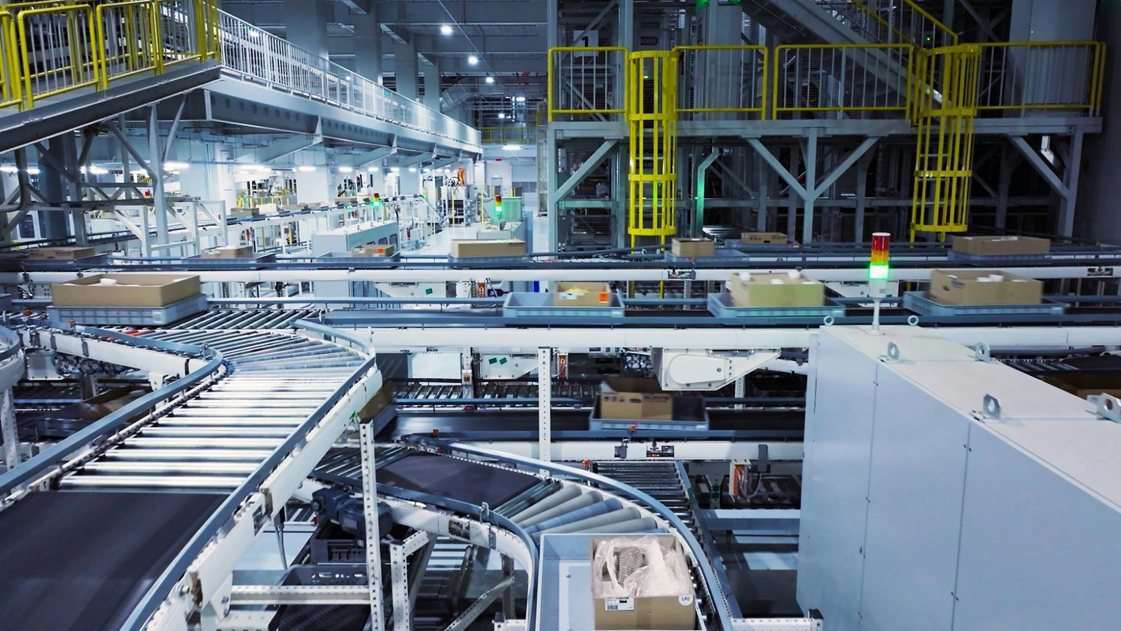 Boxes moving along an automated conveyor system in a large facility