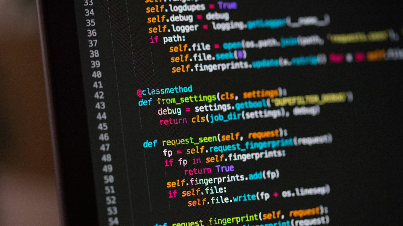 A computer screen filled with lines of colorful programming code