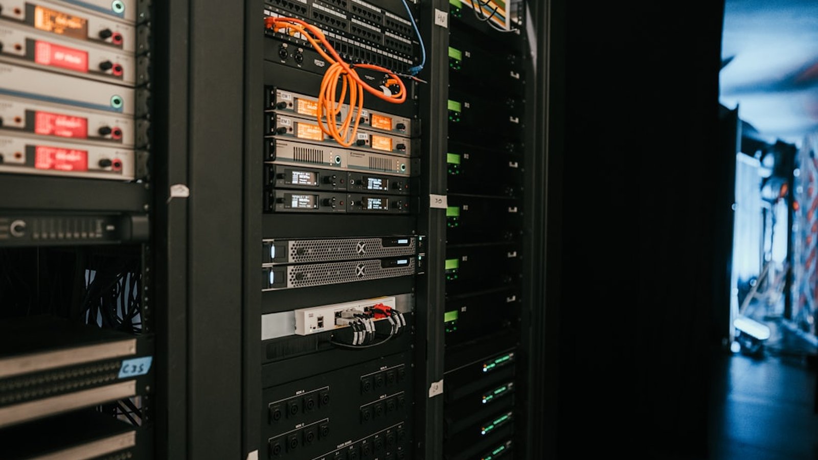 A rack of servers with status lights in a data center server room